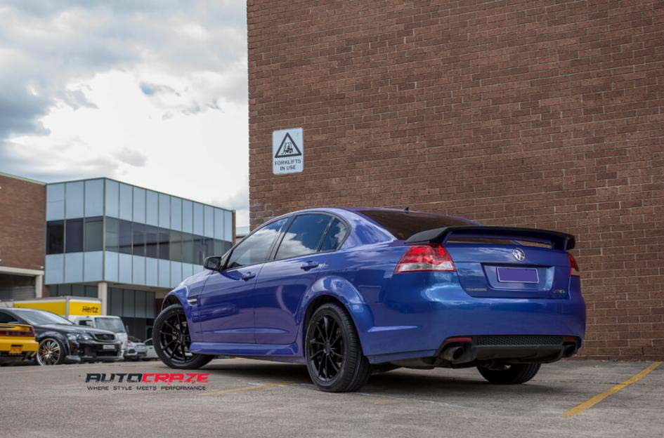 Holden Commodore with KMC wheels and Achilles tyre rear wide angle shot february 2018