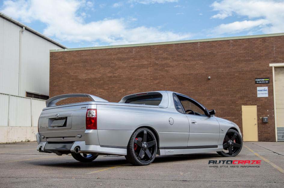 Holden Commodore with KMC wheels and Michellin tyre rear wide angle shot february 2018