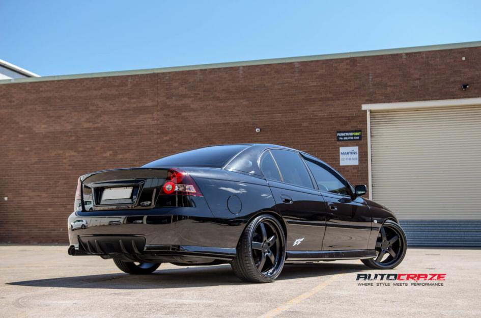 Holden Commodore with Niche wheels and Achilles tyre rear wide angle shot february 2018