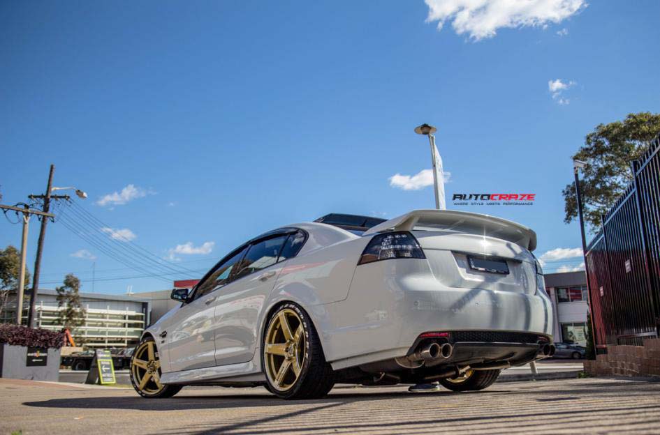 Holden Commodore with Simmons FRCS Gold wheel and Achilles tyre rear wide angle shot february 2018