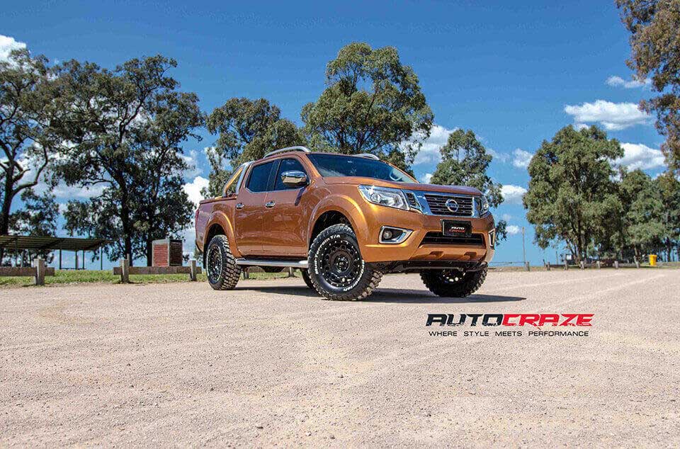 Orange Nissan Navara KMC Holeshot satin black 4x4 wheels BF Goodrich tyres