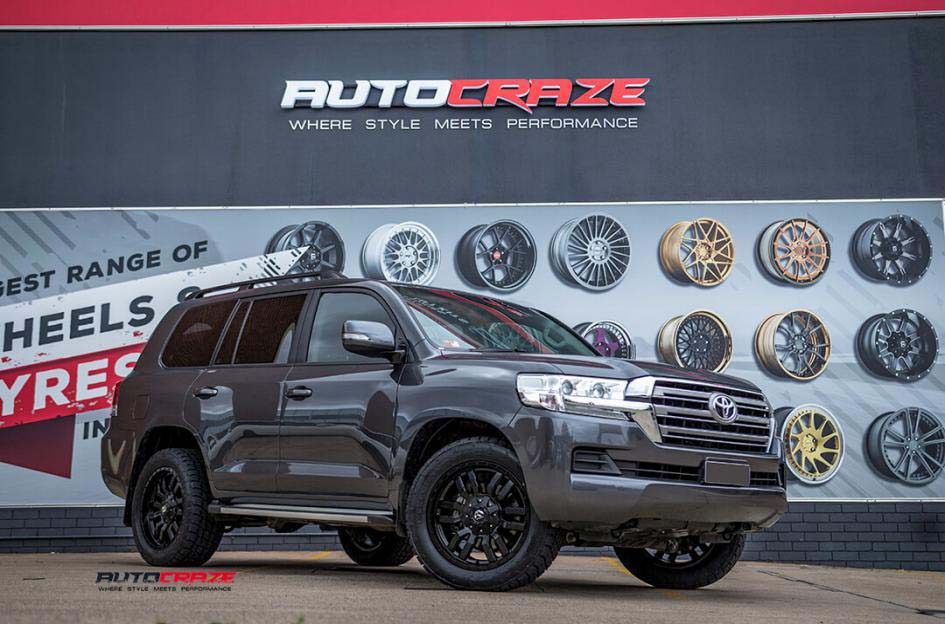 toyota landcruiser with fuel sledge matte black wheels nitto terra grappler g2 tyres front close up shot